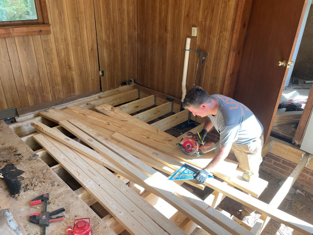 A USR employee doing a whole flooring system replacement on a home in the Upstate of South Carolina.