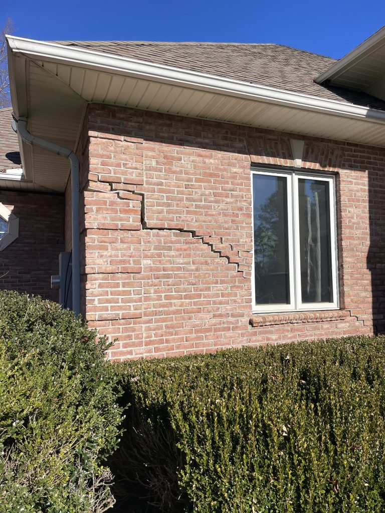 a large crack in a brick home in Sunset South Carolina due to poor compaction of the soil.